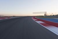 Dawn at the Race Track Stadium: A Clear Sky for Racing