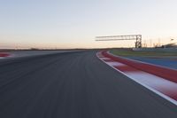 Dawn at the Race Track Stadium: A Clear Sky for Racing