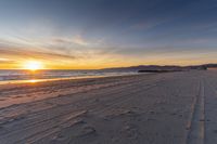 Dawn on a Coastal Road: Sand, Water, and Open Space