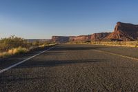 Dawn Road Through Desert Asphalt