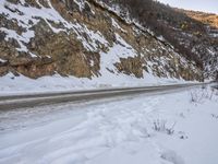 Dawn Road Through Mountain Forest in Winter