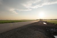 Dawn in Rural Canada: Sun and Asphalt Road