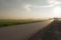 Dawn in Rural Canada: Sun and Asphalt Road