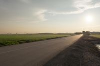 Dawn in Rural Canada: Sun and Asphalt Road