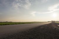 Dawn in Rural Canada: Sun and Asphalt Road