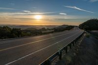 Dawn on a Rural Mountain Road: Sunlight Breaking Through Clouds