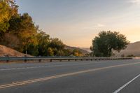 Dawn on a Rural Road: A Majestic Mountain View