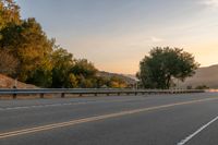 Dawn on a Rural Road: A Majestic Mountain View