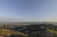 a view of hollywood from atop the mountain in the hollywood hills area of los angeles, california