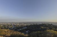 a view of hollywood from atop the mountain in the hollywood hills area of los angeles, california