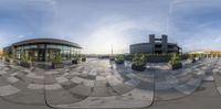 three panoramas of a modern building with a green roof with an ornamental planter in it