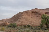 Dawn in Utah's Desert: Red Rocks and Mountains