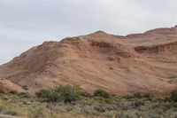 Dawn in Utah's Desert: Red Rocks and Mountains