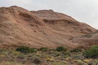 Dawn in Utah's Desert: Red Rocks and Mountains