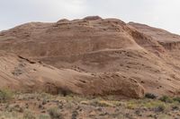 Dawn in Utah's Desert: Red Rocks and Mountains