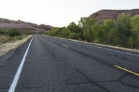 Dawn Utah Road Through Desert Red Rock Mountains