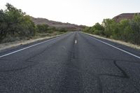 Dawn Utah Road Through Desert Red Rock Mountains