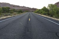 Dawn on Utah Road in Desert with Red Rock Mountain