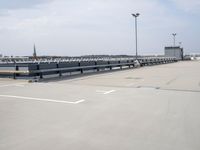 a boat is parked in an empty parking lot near an air port on the water