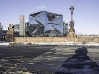 the shadow of a person is reflected in a building in the center of the city