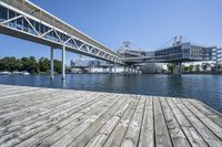 Daytime Cityscape: Overlooking the Ocean and River from a Wooden Bridge