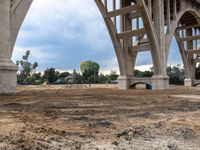 the ground beneath a bridge has been cleared from its contents and ready to be placed