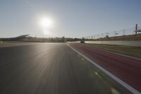 Daytime Highway with a Clear Sky and Visible Sun