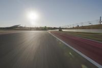 Daytime Highway with a Clear Sky and Visible Sun