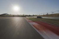 Daytime Highway with a Clear Sky and Visible Sun