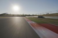 Daytime Highway with a Clear Sky and Visible Sun