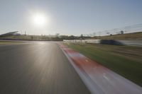 Daytime Highway with a Clear Sky and Visible Sun