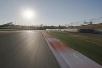 Daytime Highway with a Clear Sky and Visible Sun