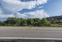 Daytime Landscape with Low Clouds and Asphalt Road