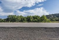 Daytime Landscape with Low Clouds and Asphalt Road