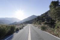 Daytime Mountain Road: Asphalt Across Mountain Landforms