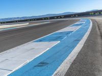 Daytime at the Race Track: Asphalt Curve Ahead