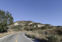 Daytime Road Trip: Clear Sky and Endless Road