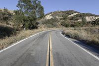 Daytime Road Trip: Clear Sky and Endless Road