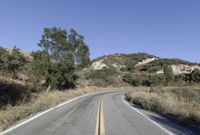 Daytime Road Trip: Clear Sky and Endless Road