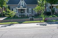 Daytime Suburban Scene: House, Tree, and Clear Sky