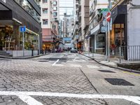 an image of a downtown street in the daytime time from a corner to the bottom