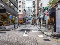 an image of a downtown street in the daytime time from a corner to the bottom