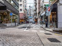 an image of a downtown street in the daytime time from a corner to the bottom