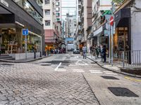 an image of a downtown street in the daytime time from a corner to the bottom