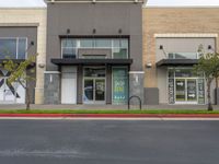 Daytime View of Storefront in Suburban Area with Vegetation