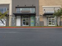 Daytime View of Storefront in Suburban Area with Vegetation