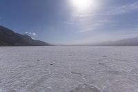 a desert plain with no clouds or sun in it, it looks like the sky is moving