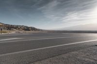 Death Valley Road: Asphalt Stretched Into the Horizon