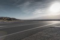 Death Valley Road: Asphalt Stretched Into the Horizon