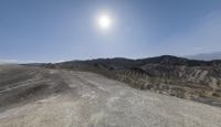 the desert at death valley national park has no clouds on this day, but no sunlight